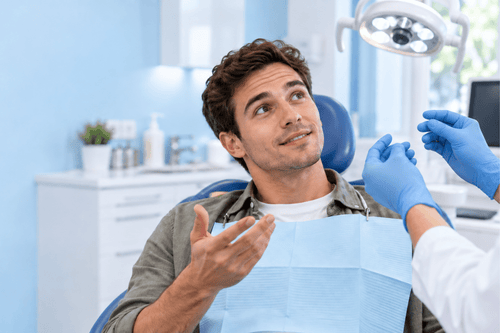 Man consulting an orthodontist about a replacement retainer in a dental clinic.