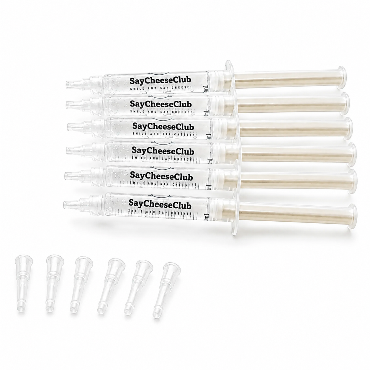 Five clear plastic syringe-style tubes labeled SayCheeseClub, arranged horizontally on a white background, with five small clear applicator tips lined up below.