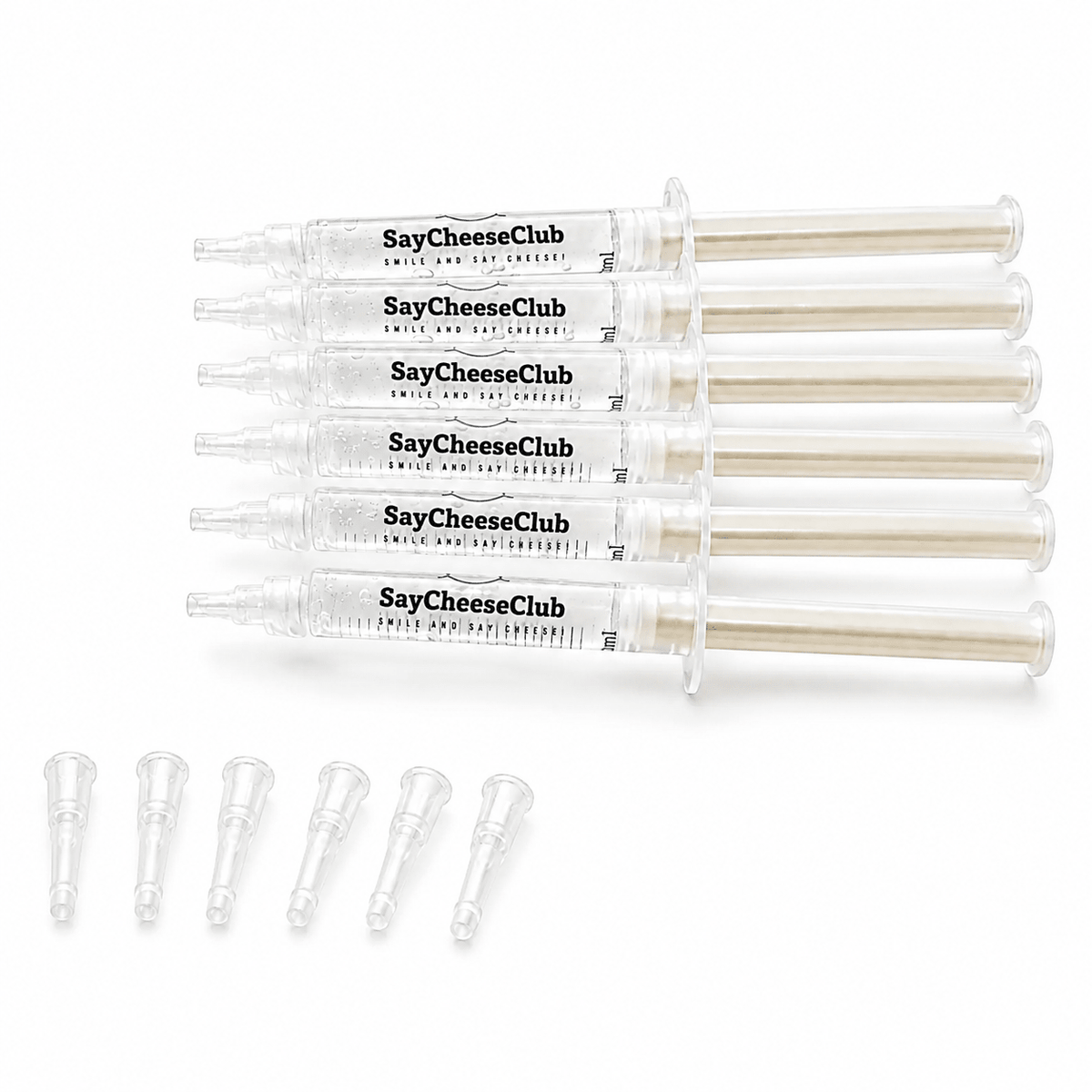 Five clear plastic syringe-style tubes labeled SayCheeseClub, arranged horizontally on a white background, with five small clear applicator tips lined up below.