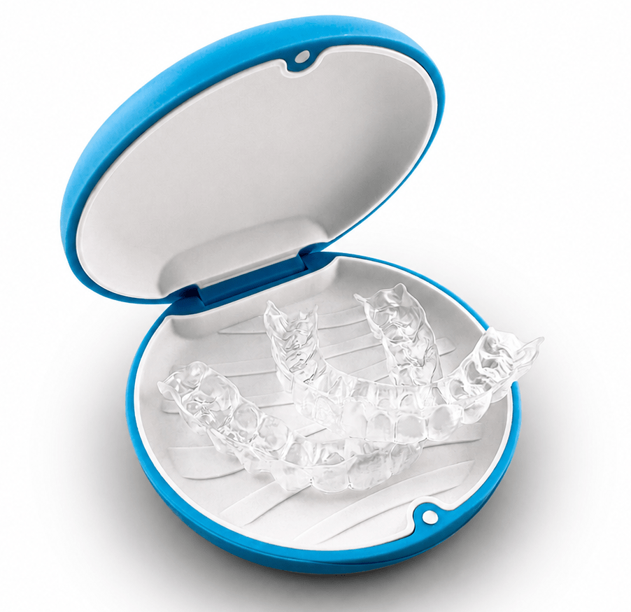 A set of clear transparent dental aligners displayed inside an open round case with a blue rim and white interior on a light gray background.