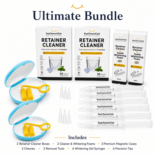 Ultimate Bundle of SayCheeseClub dental whitening and retainer cleaning products, including two retainer cleaner boxes, three whitening foam tubes, two open magnetic cases with yellow retainer rings, several clear syringes, and applicator tips, all arranged on a white background with text detailing the included items.