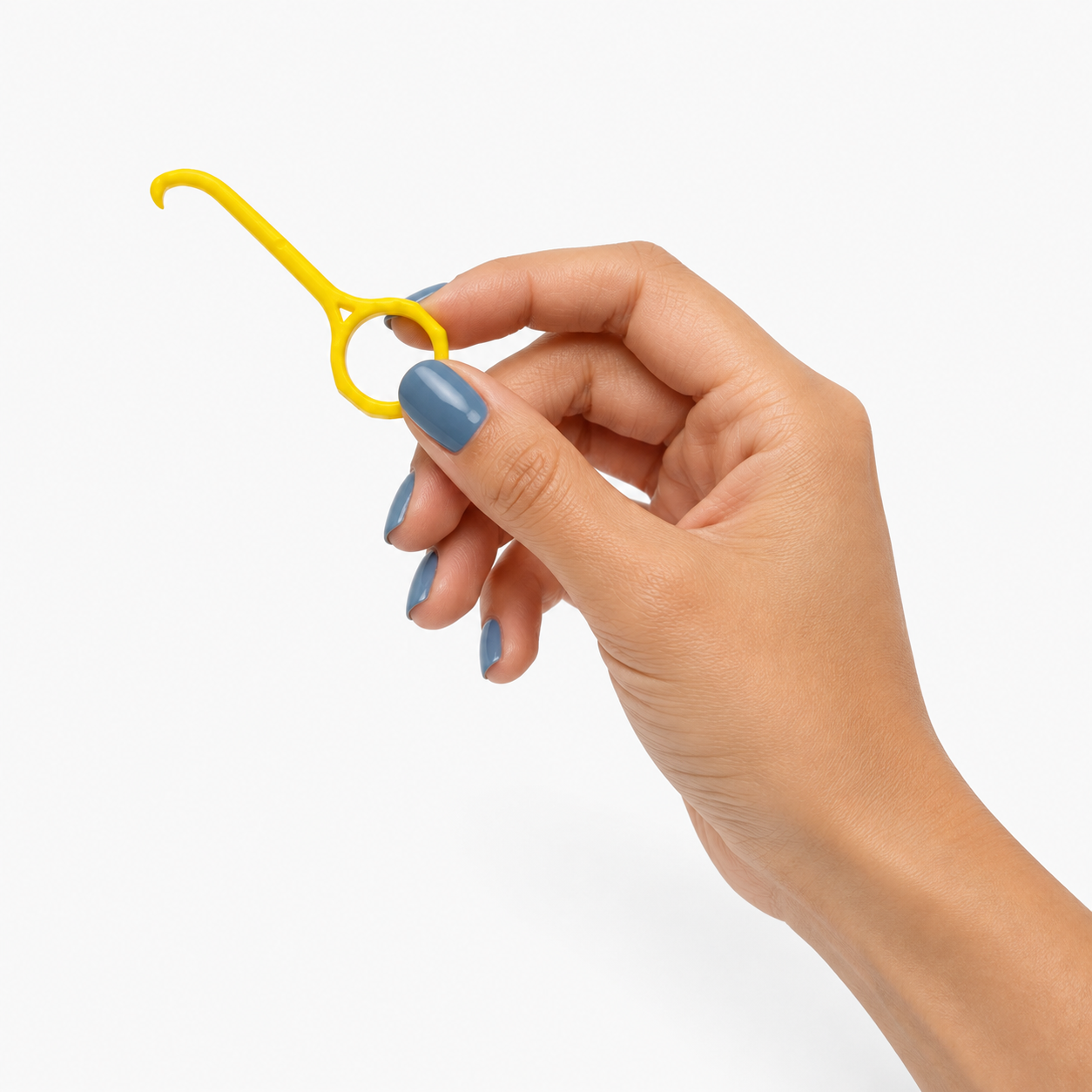 A hand with blue nail polish holds a small yellow plastic retainer removal tool against a clean white background.