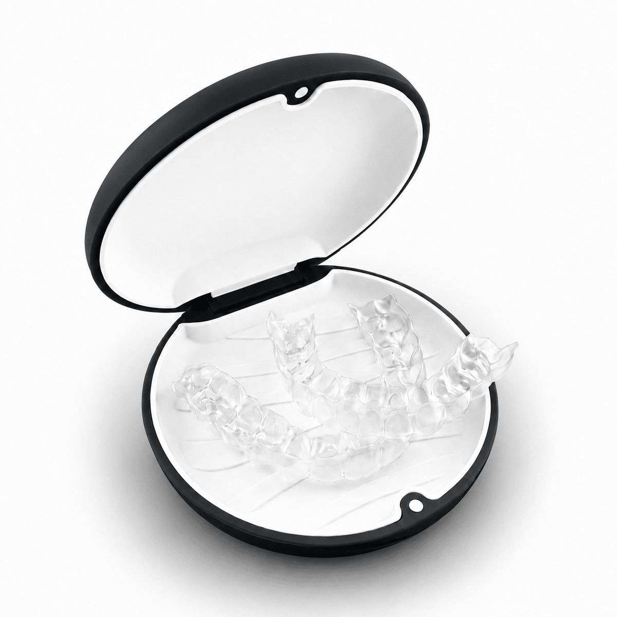 A clear set of transparent dental mouthguards displayed inside an open black and white oval case on a white background.