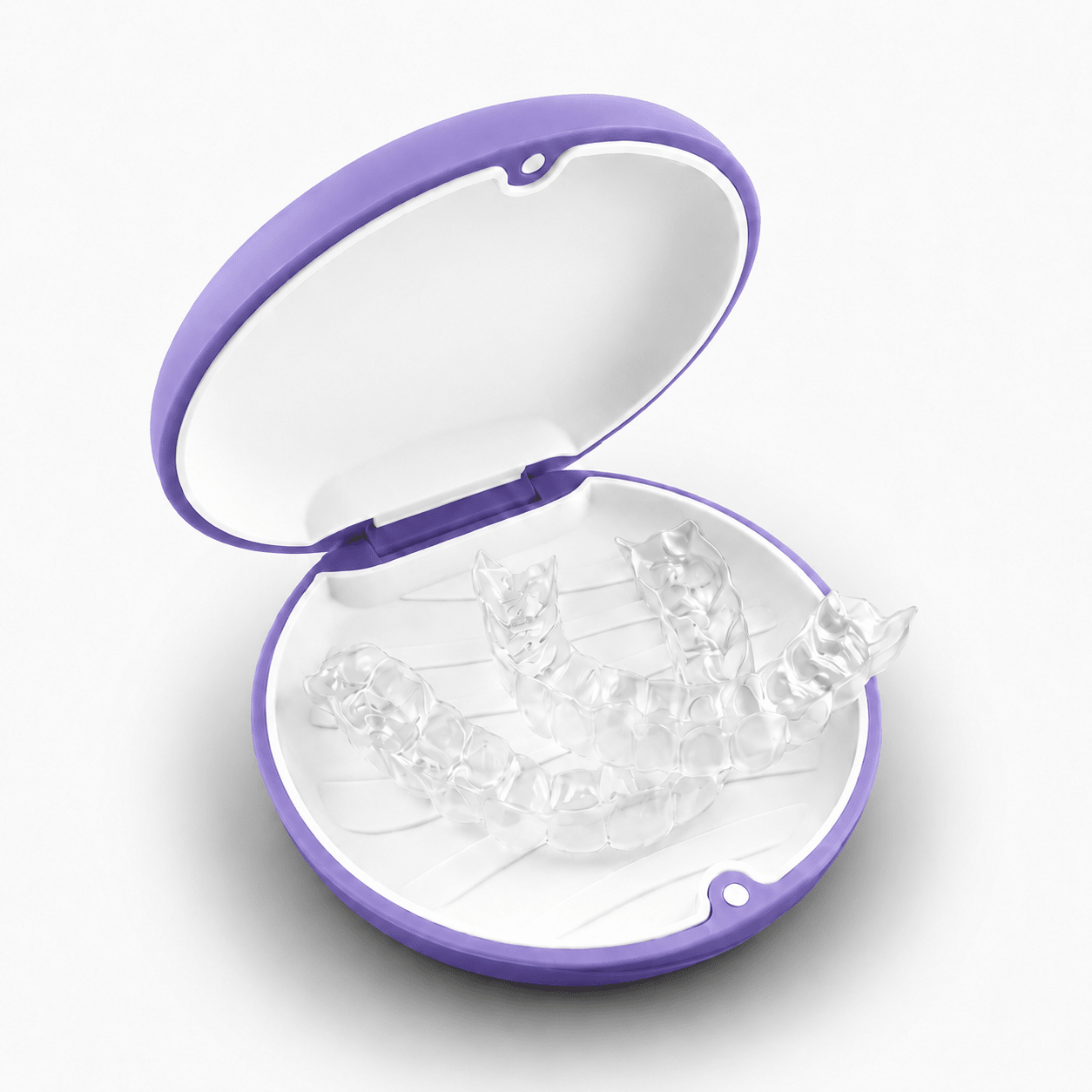 A set of clear transparent dental aligners displayed inside an open round case with a purple rim and white interior, on a clean white background.