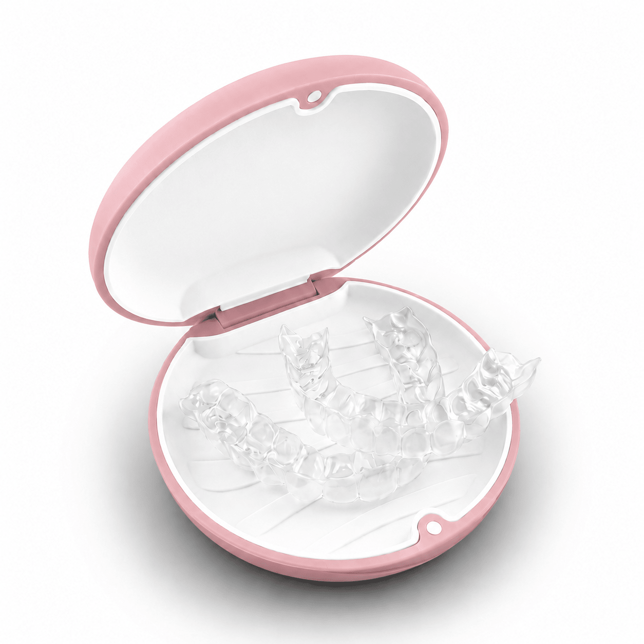 A round pink hard retainer case with a simple embossed smiley face on top, photographed on a clean white background.  Also good for clear aligner case.