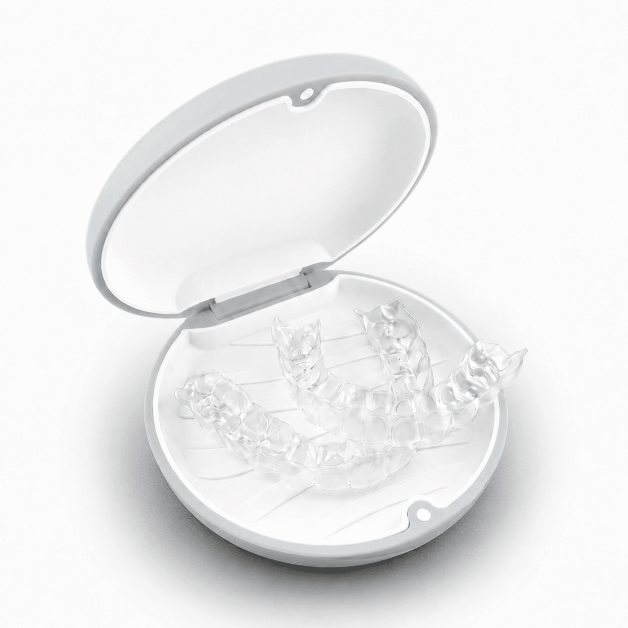 A round white hard retainer case with a simple embossed smiley face on top, photographed on a clean white background.  Also good for clear aligner case.