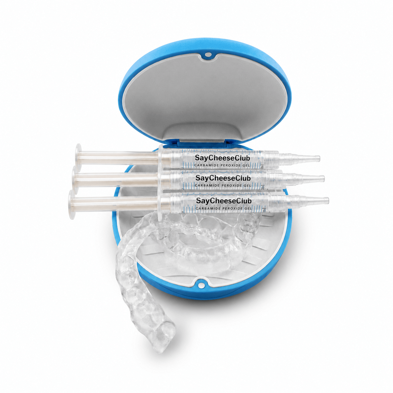 Three clear whitening tray syringe-style applicator tools labeled SayCheeseClub are arranged in front of an open blue-and-white round case, with a clear curved applicator piece resting in front on a white background.