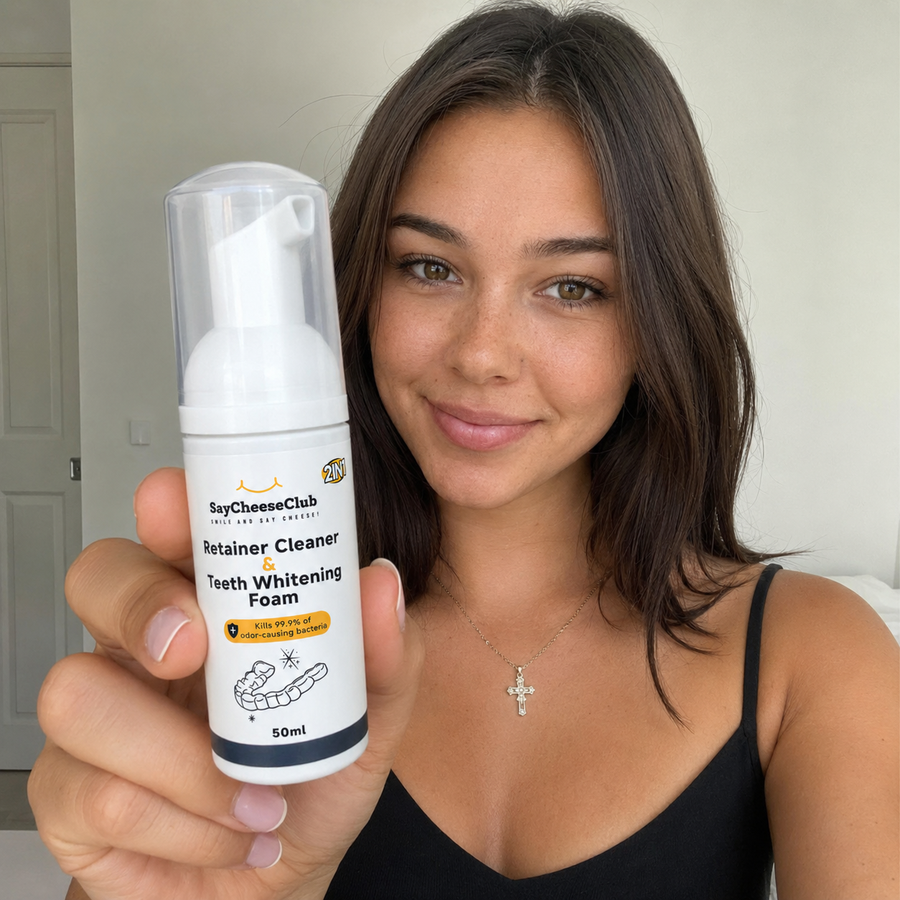 Woman holding the Cleaner and Whitening Foam pump bottle