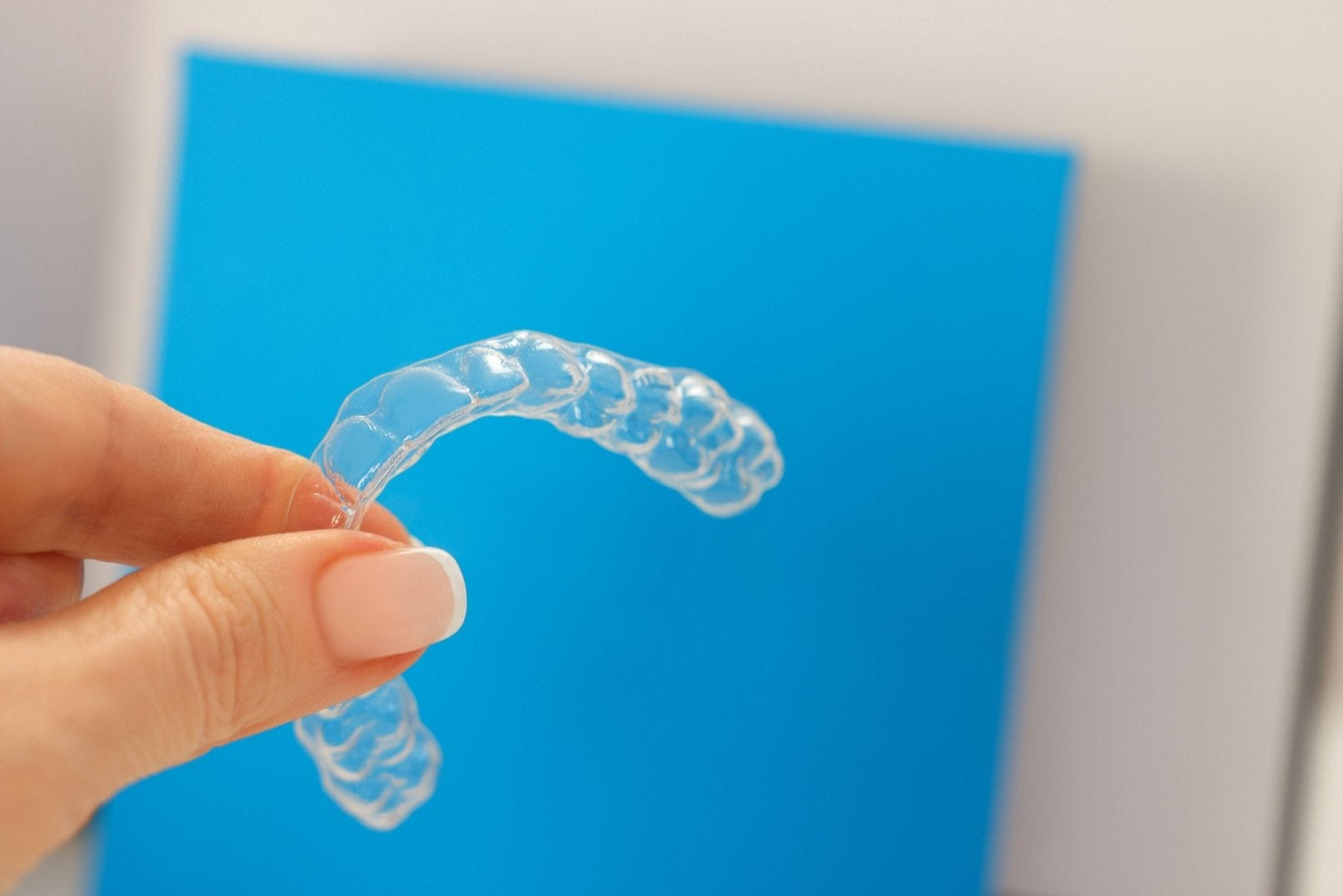 Custom lower clear dental orthodontic retainer crafted to preserve teeth alignment and prevent movement after orthodontic care.